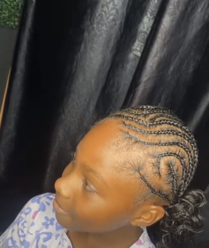 Child's cornrows braided straight back.