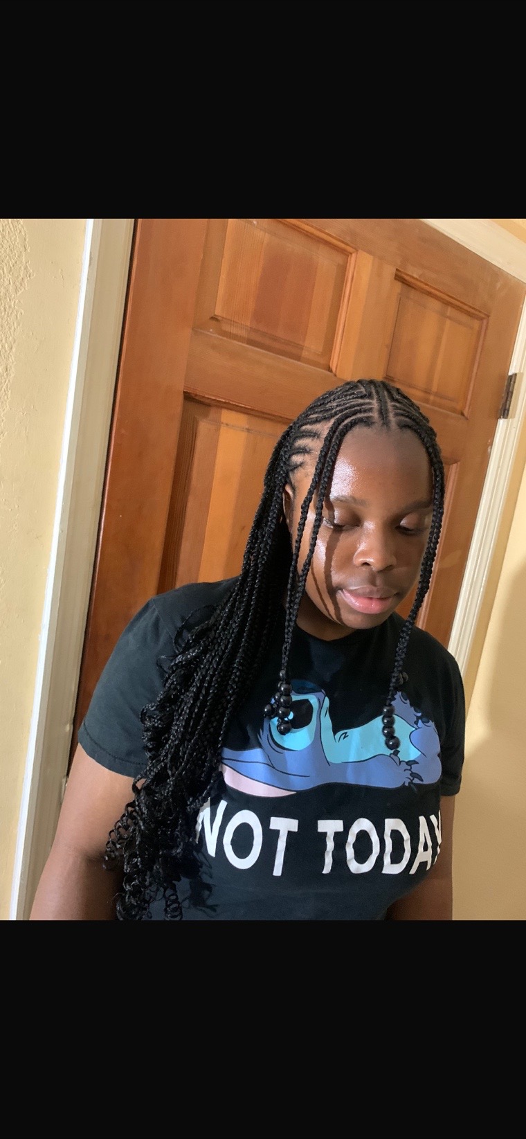 Shoulder-length knotless braids.