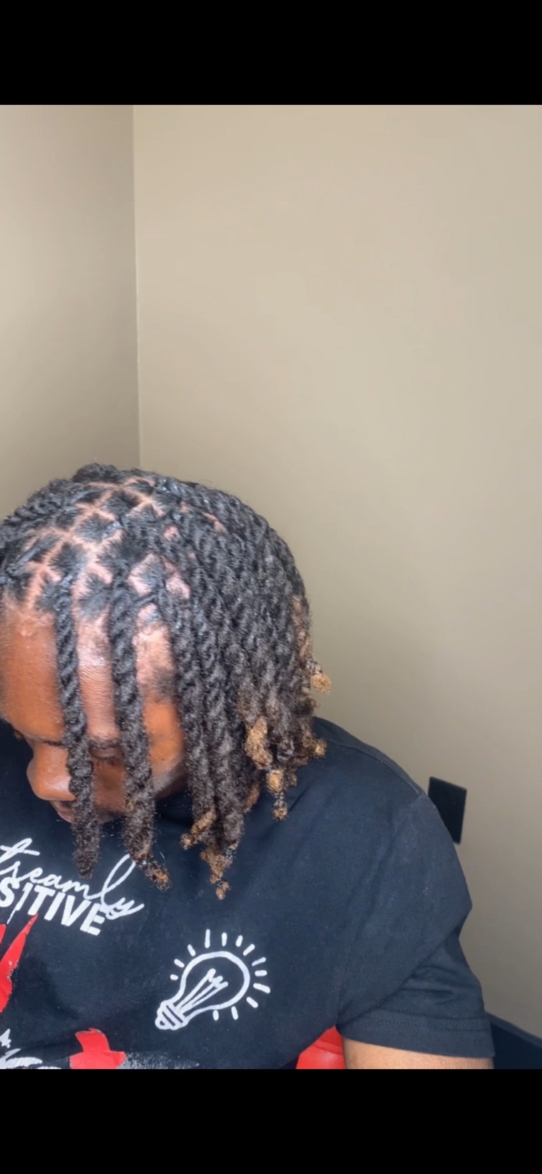 Two-strand twisted locs after maintenance.